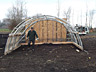 Larry builds a shelter for the pigs during the winter of 2015 on Delta.
